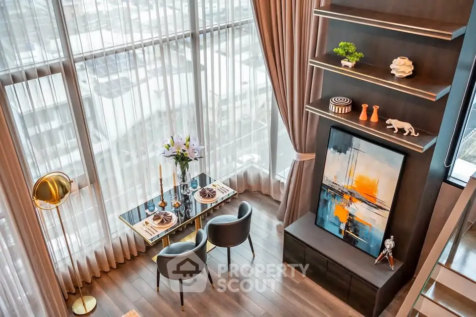 Luxurious modern living room with floor-to-ceiling windows and elegant decor.