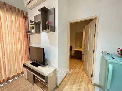 Cozy living room with modern TV setup and stylish shelving