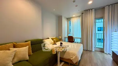 Modern studio apartment with cozy living area and stylish decor