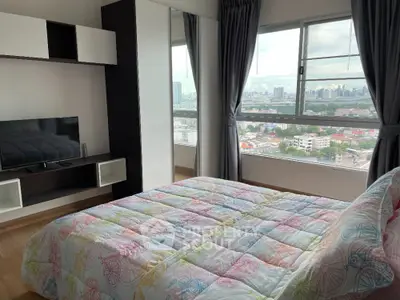 Bright bedroom with city view and colorful bedding in modern apartment