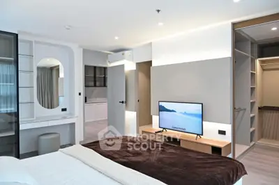 Luxurious modern bedroom with sleek design and built-in TV unit