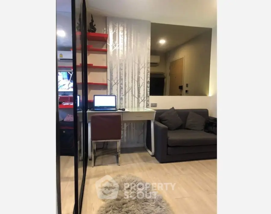 Modern living room with cozy sofa and stylish workspace setup