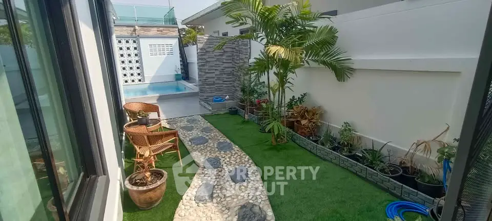 Charming garden with poolside view and lush greenery in modern home