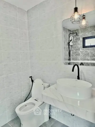 Modern bathroom with sleek fixtures and elegant tile design