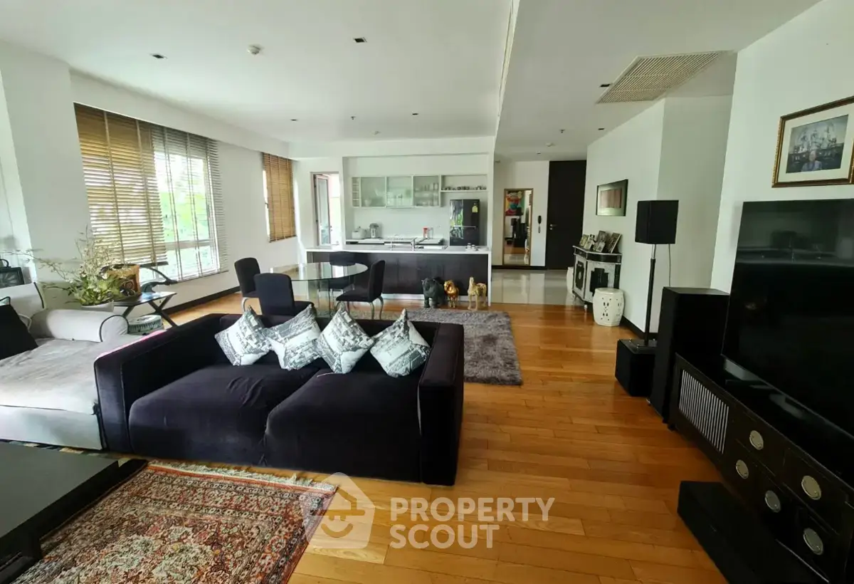 Spacious modern living room with open kitchen and elegant decor