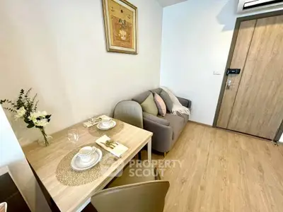 Cozy living room with dining area and modern decor in a stylish apartment.