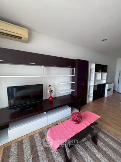 Modern living room with sleek furniture and stylish decor in a contemporary apartment.