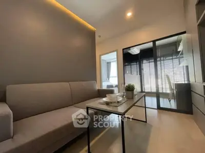 Modern living room with sleek furniture and natural light
