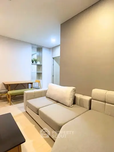 Modern living room with cozy beige sofa and stylish decor