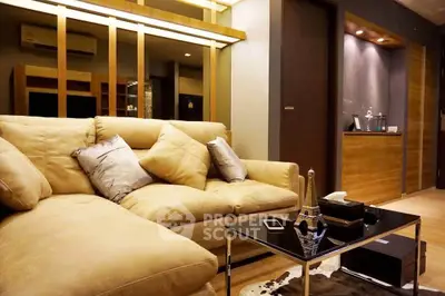 Luxurious living room with plush sofa and modern decor, perfect for relaxation and entertaining.