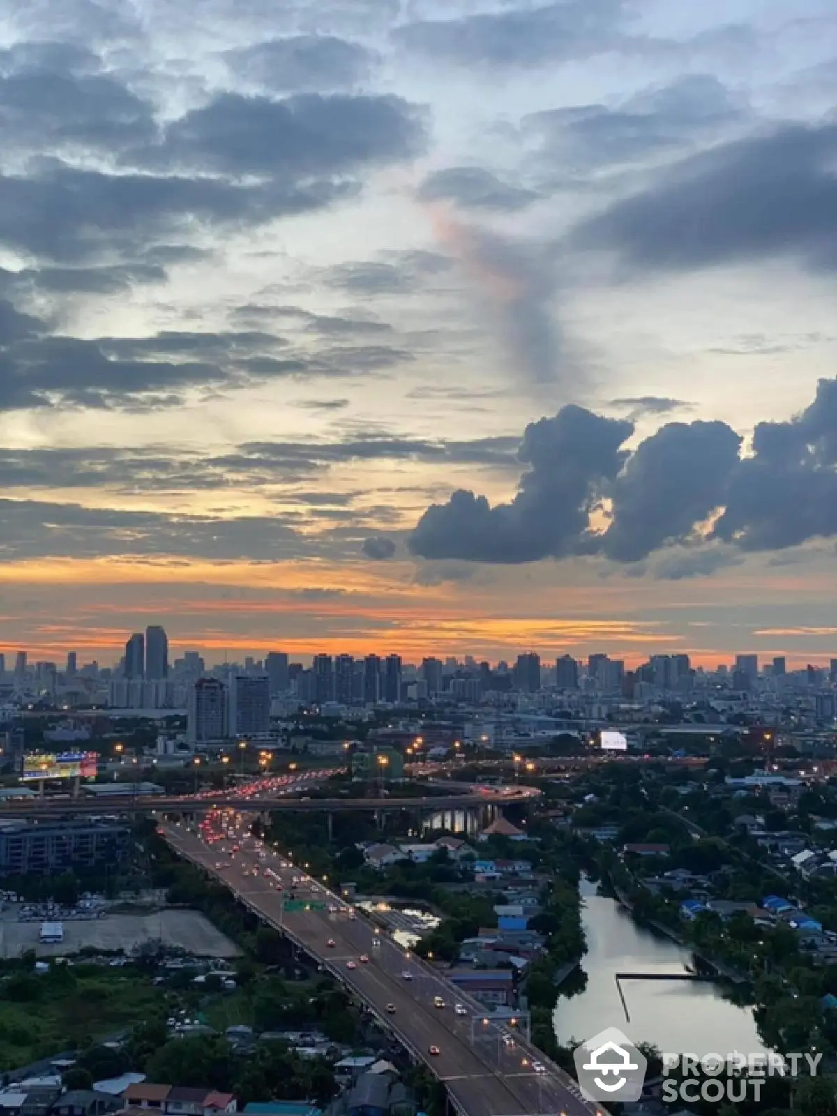 Stunning cityscape view at sunset with vibrant skyline and bustling roads