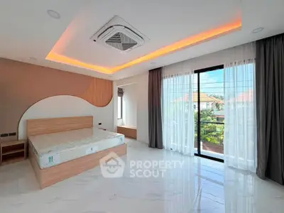 Spacious modern bedroom with large windows and elegant ceiling design