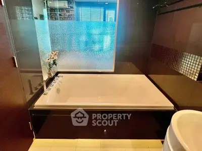 Luxurious bathroom with modern bathtub and elegant design features.