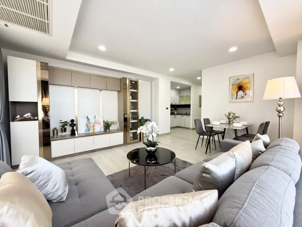 Spacious modern living room with elegant decor and open dining area