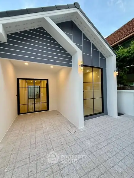 Modern house exterior with sleek design and spacious entrance