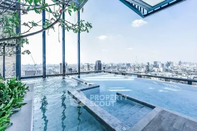 Stunning rooftop infinity pool with panoramic city skyline view
