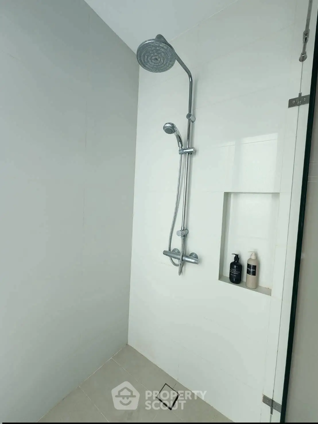 Modern bathroom with sleek shower fixtures and minimalist design