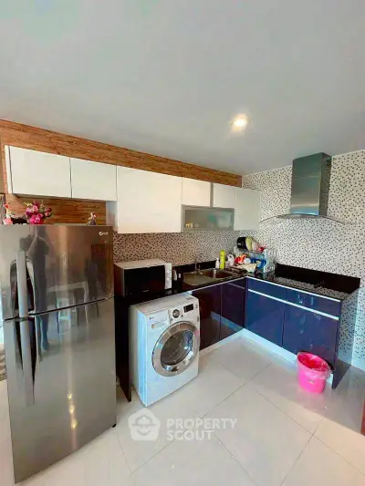 Modern kitchen with sleek appliances and stylish cabinetry