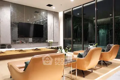 Luxurious modern living room with elegant decor and large windows overlooking a serene garden view.