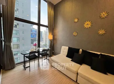 Modern living room with floor-to-ceiling windows and stylish decor in urban apartment