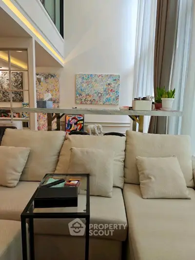 Luxurious modern living room with high ceilings and elegant decor