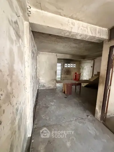 Spacious unfinished basement with potential for renovation and customization.