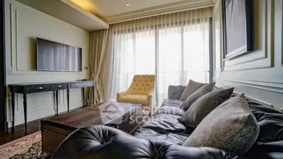 Luxurious living room with elegant decor and large windows for natural light.