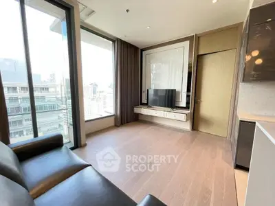 Modern living room with large windows and city view, featuring sleek furniture and wooden flooring.