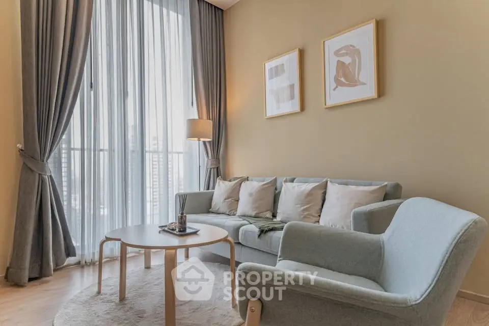 Stylish living room with modern furniture and large window view