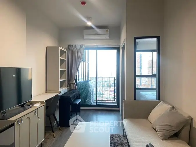 Modern studio apartment with open layout kitchen, cozy living area, and balcony access, featuring ample natural light and a sleek design.