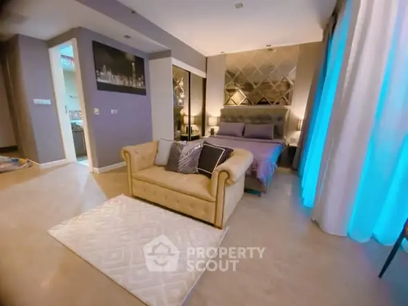 Luxurious bedroom with elegant decor and cozy seating area