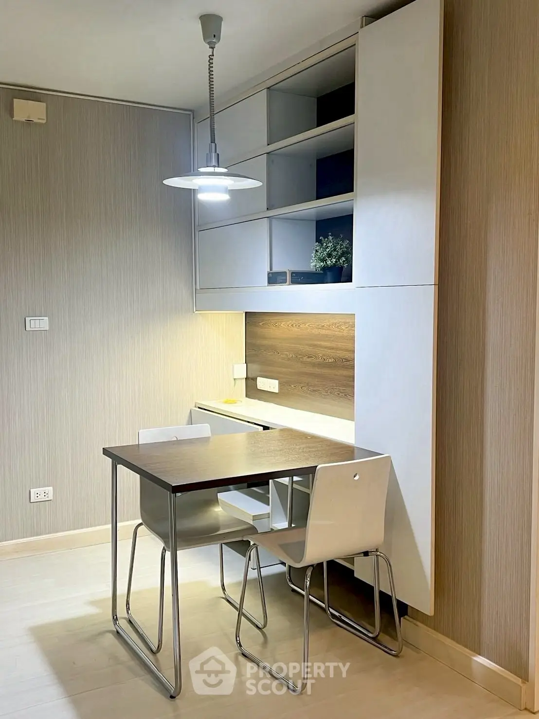 Modern study area with sleek desk and built-in shelving, perfect for productivity.