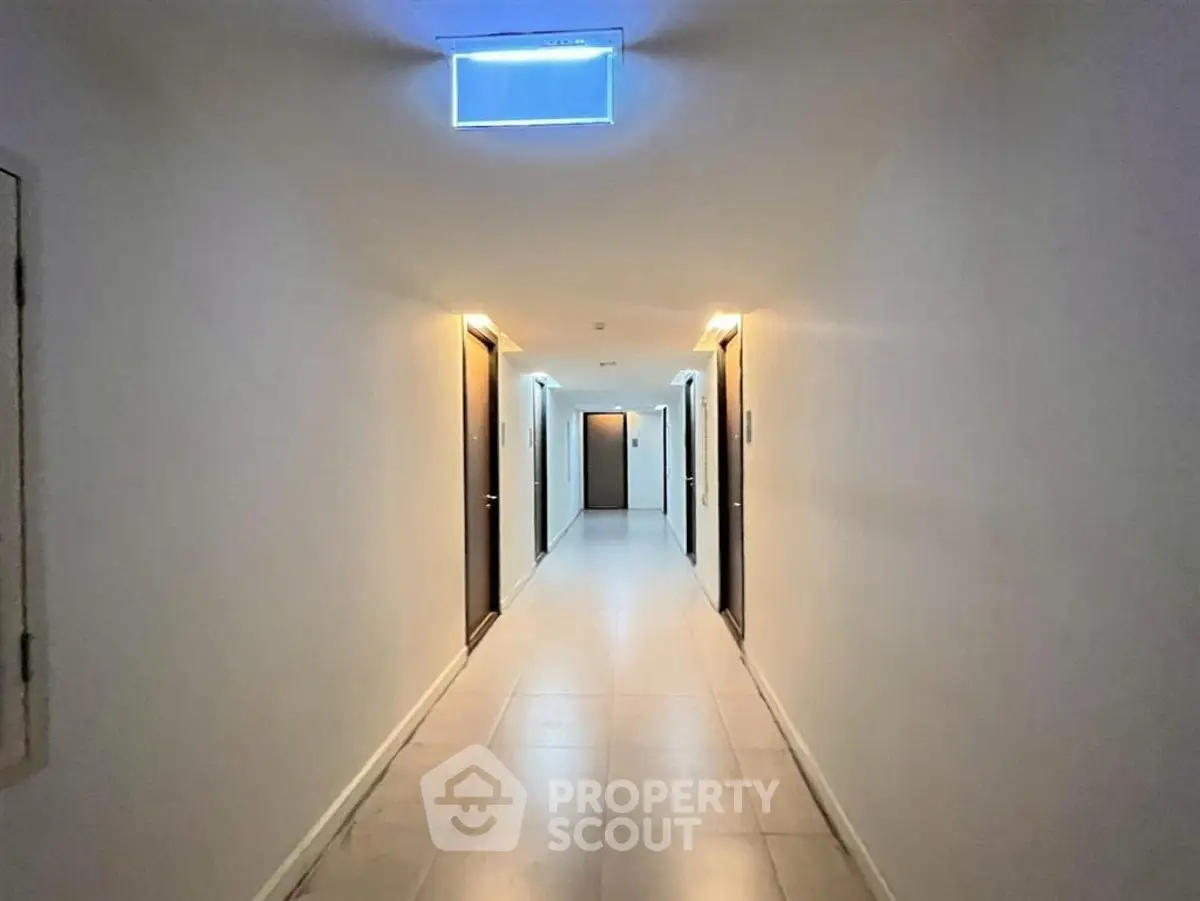 Spacious corridor with modern lighting in a residential building