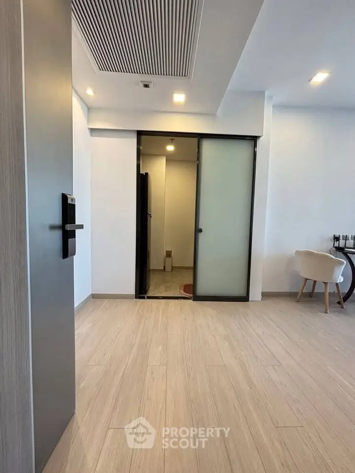 Modern apartment interior with sliding door and stylish dining area