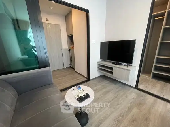 Modern living room with sleek design and wall-mounted TV