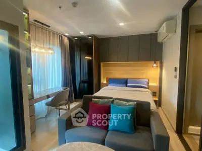 Modern studio apartment with cozy living area and stylish decor