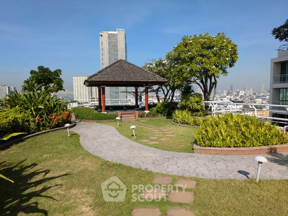 Stunning rooftop garden with city views and charming gazebo in urban setting