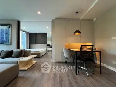 Modern open-plan living room with stylish furniture and natural light