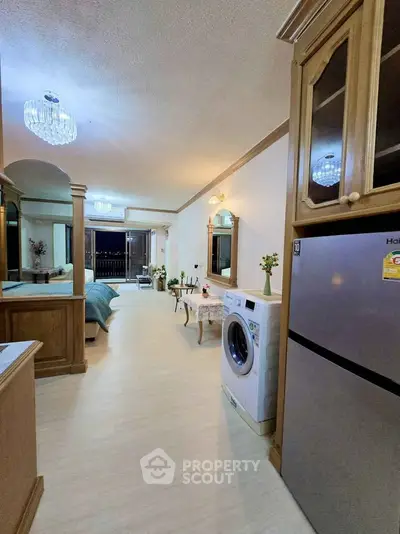 Spacious open-plan living area with modern appliances and elegant decor