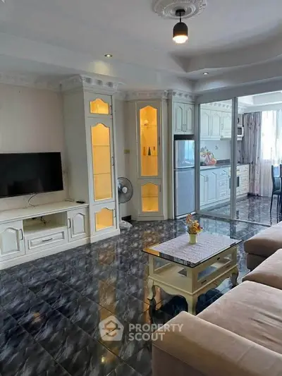 Spacious living room with elegant decor and open kitchen layout