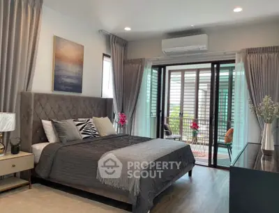 Luxurious bedroom with elegant decor and balcony access