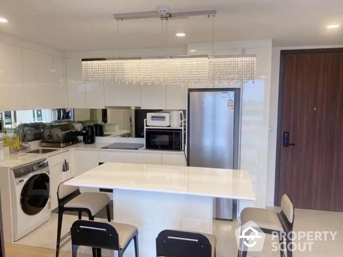 Modern kitchen with sleek appliances and stylish island seating