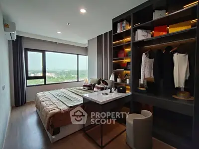 Modern bedroom with stylish walk-in closet and scenic view