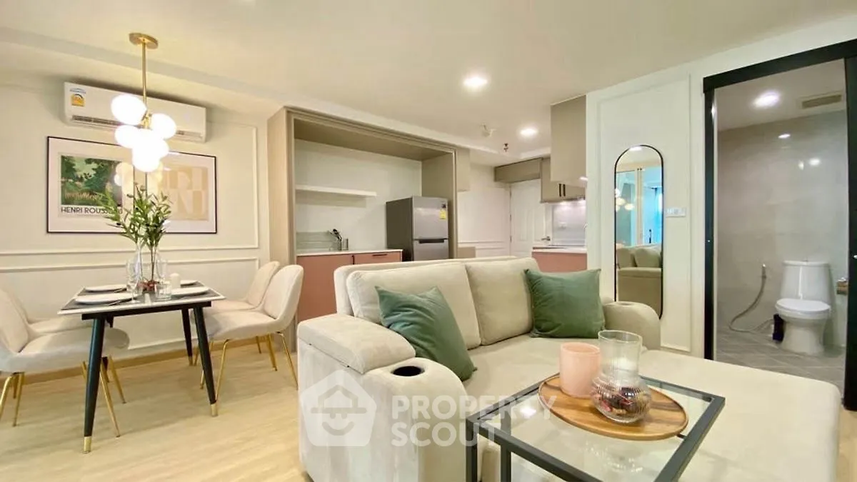 Modern living room with elegant dining area and open kitchen layout