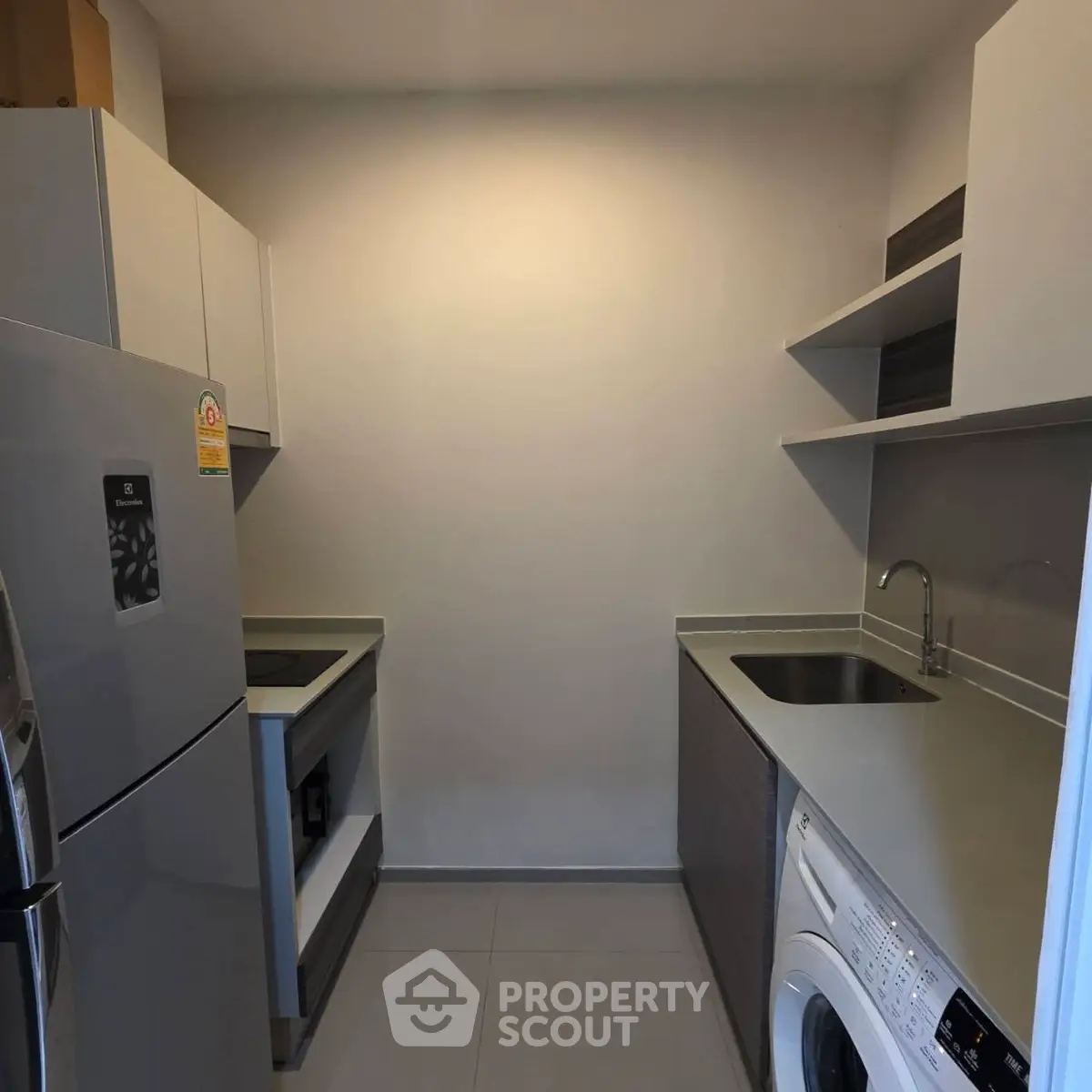 Modern kitchen with sleek appliances and ample storage space