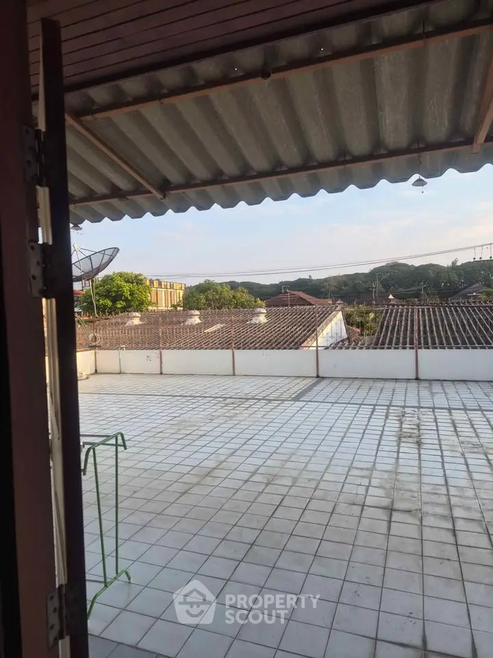 Spacious rooftop terrace with scenic views, perfect for outdoor relaxation and entertainment.