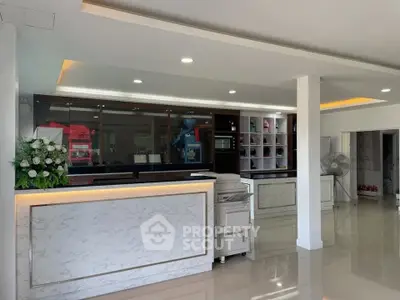 Modern reception area with marble counters and sleek lighting