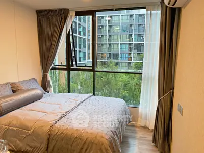 Modern bedroom with large window and city view in luxury apartment