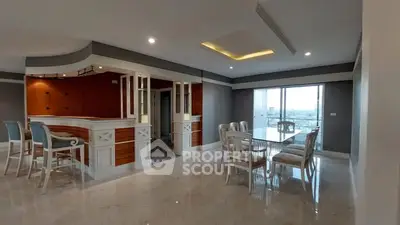 Spacious modern living room with elegant dining area and large windows offering stunning views.