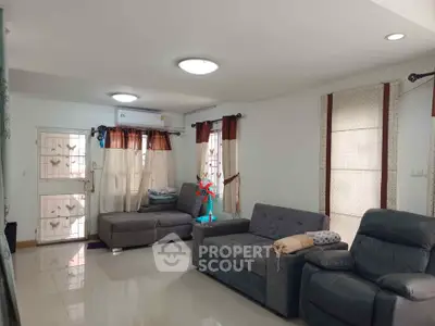 Spacious living room with modern furniture and natural light